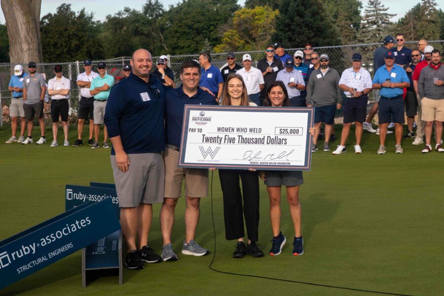 Building Communities Golf Classic Women in Trades Beneficiary and Big Check, Women in Construction Week 2024